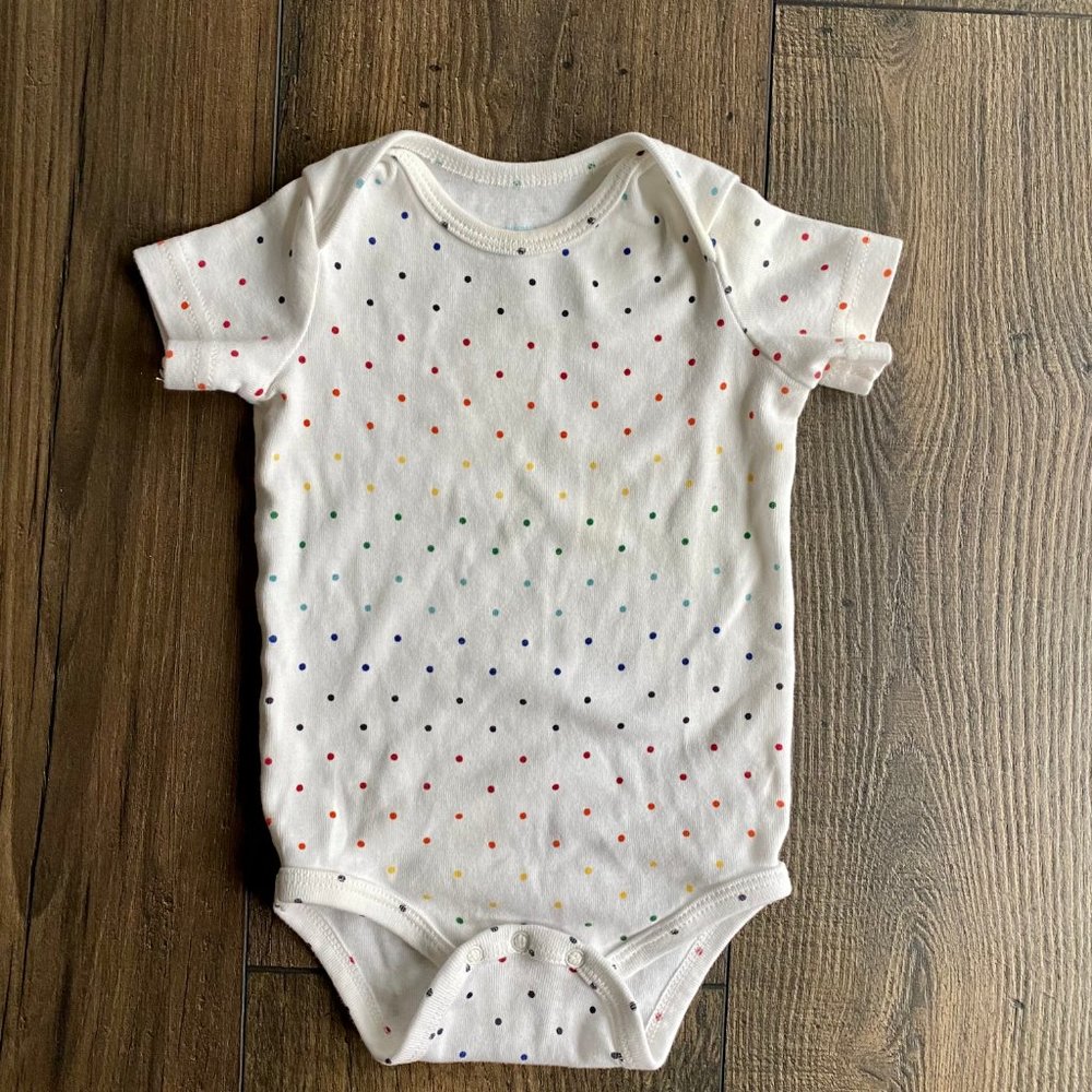 Primary rainbow dot onesie
